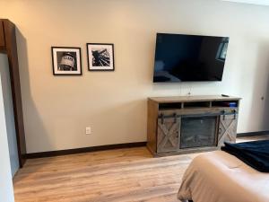 a living room with a flat screen tv on a wall at Airstay LLC in Clark
