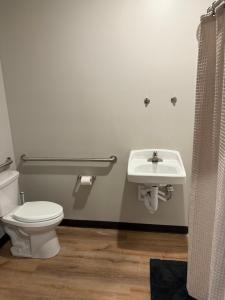 a bathroom with a toilet and a sink at Airstay LLC in Clark