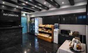 a store with a refrigerator and a counter with food at Sasang Goyohan-hotel in Busan