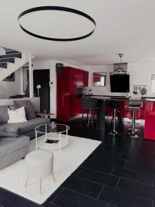 a living room with a couch and a table at Ailiv Room - Lovely Room in Capriasca in Arni Alp