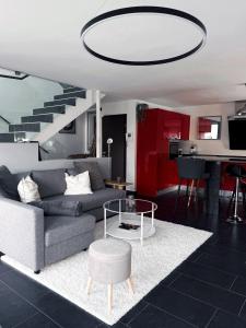 a living room with a couch and a table at Ailiv Room - Lovely Room in Capriasca in Arni Alp