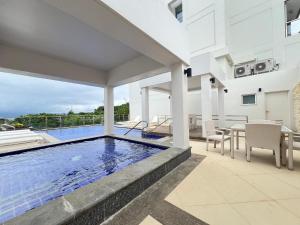 a swimming pool in the middle of a house at Serenity Ocean Garden Boracay in Boracay