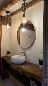 a bathroom with a sink and a mirror at Coco Cabaña Barú in Cartagena de Indias