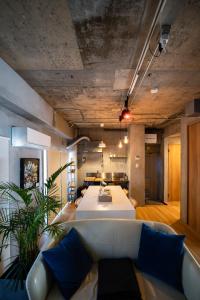 a living room with a couch and a table at Shiki Villa Beppu in Beppu +160 photos
