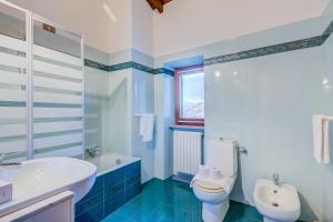 a bathroom with a sink and a toilet and a tub at Casa al Castello in Leggiuno with Garden - Happy Rentals in Leggiuno