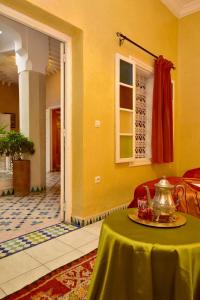 a room with a table with a tea kettle on it at Riad Manissa in Marrakesh