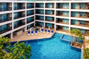 an aerial view of a building with a swimming pool at Kata Beach Pool View Condo - 400m from the Beach in Kata Beach