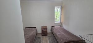 a room with two beds and a window at Hasmik house in Areni