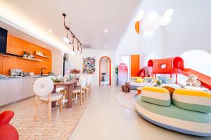 a childrens room with a kitchen and a dining room at Candy House Private Pool Villa & KTV in Ban Nong Chaeng