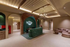 a large lobby with a large tub in the middle of the room at Là Thông Boutique Đà Lạt in Da Lat