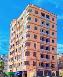 a tall building with balconies on the side of it at Bamburi Mombasa two bedrooms at Cutraz homes villa 003 in Mombasa