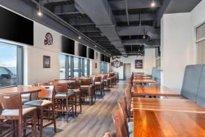 a row of tables and chairs in a restaurant at Clarion Pointe in Winnipeg