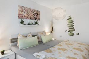 a bedroom with a bed and pillows at Fewo Bella in Stegen