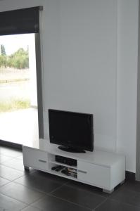 A television and/or entertainment centre at Villa Kefalonian Dream