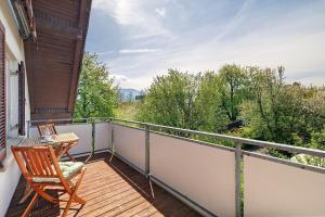 a balcony with a table and a chair on it at Appartement Panoramablick in Lustenau