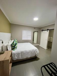 a bedroom with a bed and a chair in it at The Nathaniel in Blue Bend +65 photos