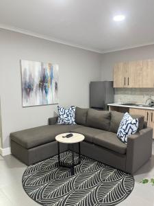 a living room with a couch and a table at The Nathaniel in Blue Bend