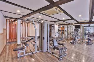 a gym with several treadmills and cardio machines at Avari Xpress Multan in Multan