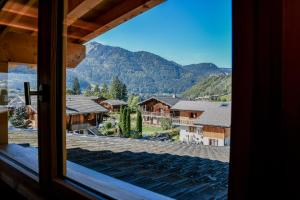 a view from a window of a mountain at Portes du Soleil T3 "comme un chalet" direct access Morzine Avoriaz in Montriond
