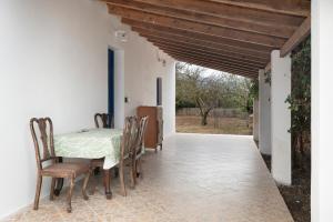 a dining room with a table and chairs at Angelina's Cute House in Neapoli Voion