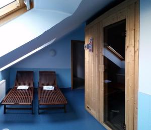 Postel nebo postele na pokoji v ubytování Hotel Střelnice