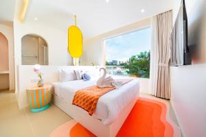 a bedroom with a bed and a large window at Candy House Private Pool Villa & KTV in Ban Nong Chaeng