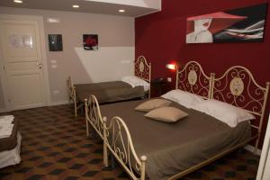 Letto o letti in una camera di B&B Suite Cutelli