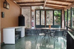 a kitchen with a table and chairs in a room at Casa Braun in Bonassola +31 photos