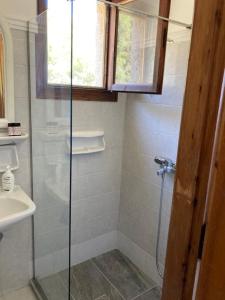 a bathroom with a shower and a sink at Agistri Island Dream in Skala