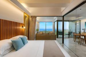 a bedroom with a bed and a living room at The Loft Mirissa in Mirissa +31 photos