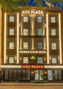 an apartment building with the amu plaza hotel at Hotel Anu Plaza - Newly Built Hotel With Parking Just 6 Mins from Connaught Place ,New Delhi Railway Station & Metro Station in New Delhi
