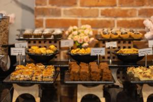 a display of different types of cakes and pastries at New Wave Hotel in Batumi