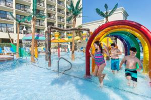a group of children playing in the water at a water park at Sea Crest Oceanfront Resort in Myrtle Beach