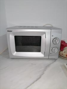 a microwave oven sitting on top of a counter at Beach lodge in Chebba +18 photos