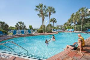 a group of people playing in a swimming pool at Sea Crest Oceanfront Resort in Myrtle Beach