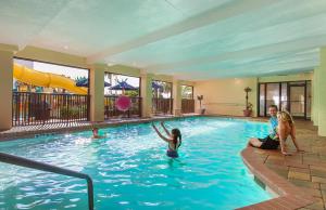 a group of people playing in a swimming pool at Sea Crest Oceanfront Resort in Myrtle Beach