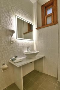 a bathroom with a sink and a mirror at Istanbul Life Hotel in Istanbul