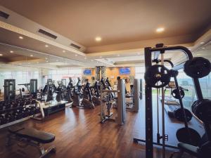 a gym with a lot of treadmills and machines at ON Hotels Oceanfront Adults Designed in Matalascañas