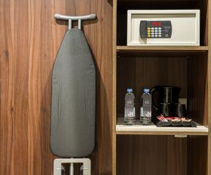 a skateboard is hanging from a door in a cupboard at فندق لفيف العريض - Lafeef Hotel Al-Aridh in Medina +9 photos