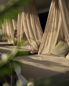 a row of beds with white curtains on them at Sankt Jörgen Park in Gothenburg