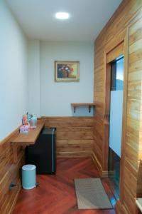 a room with a counter and a desk in a room at Salty Pearl Beach Front Phuket 3 in Patong Beach