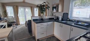 a kitchen with a sink and a counter top at Billing Aquadrome ,2 bedrooms, Royale Poplar KM 12 in Great Billing