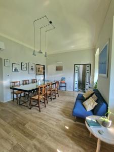 a living room with a blue couch and a table at Villa Cangallo in Chiavari