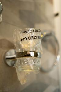 a close up of a pair of glasses with a bottle at Apartman 4B H Pozarevac in Požarevac