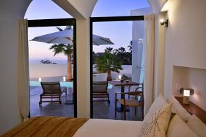a bedroom with a bed and a view of the ocean at Casa Alisios Sea View Villa private Infinity Pool Sunsets in La Pared