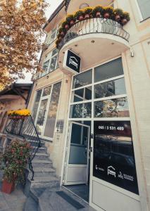 a door to a store with a sign on it at Apartman 4B H Pozarevac in Požarevac