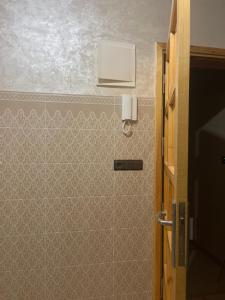 a bathroom with a shower with a wall at Rachid in Oulad Akkou +5 photos