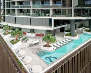 an aerial view of a building with a swimming pool at Matcha Madness Zen Escape - Riverfront in Brisbane