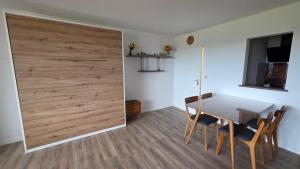 a dining room with a table and a sliding door at Allgäuer Ausblick in Missen-Wilhams