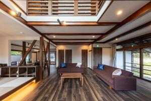 a living room with a couch and a table at Anto Azumino in Azumino
